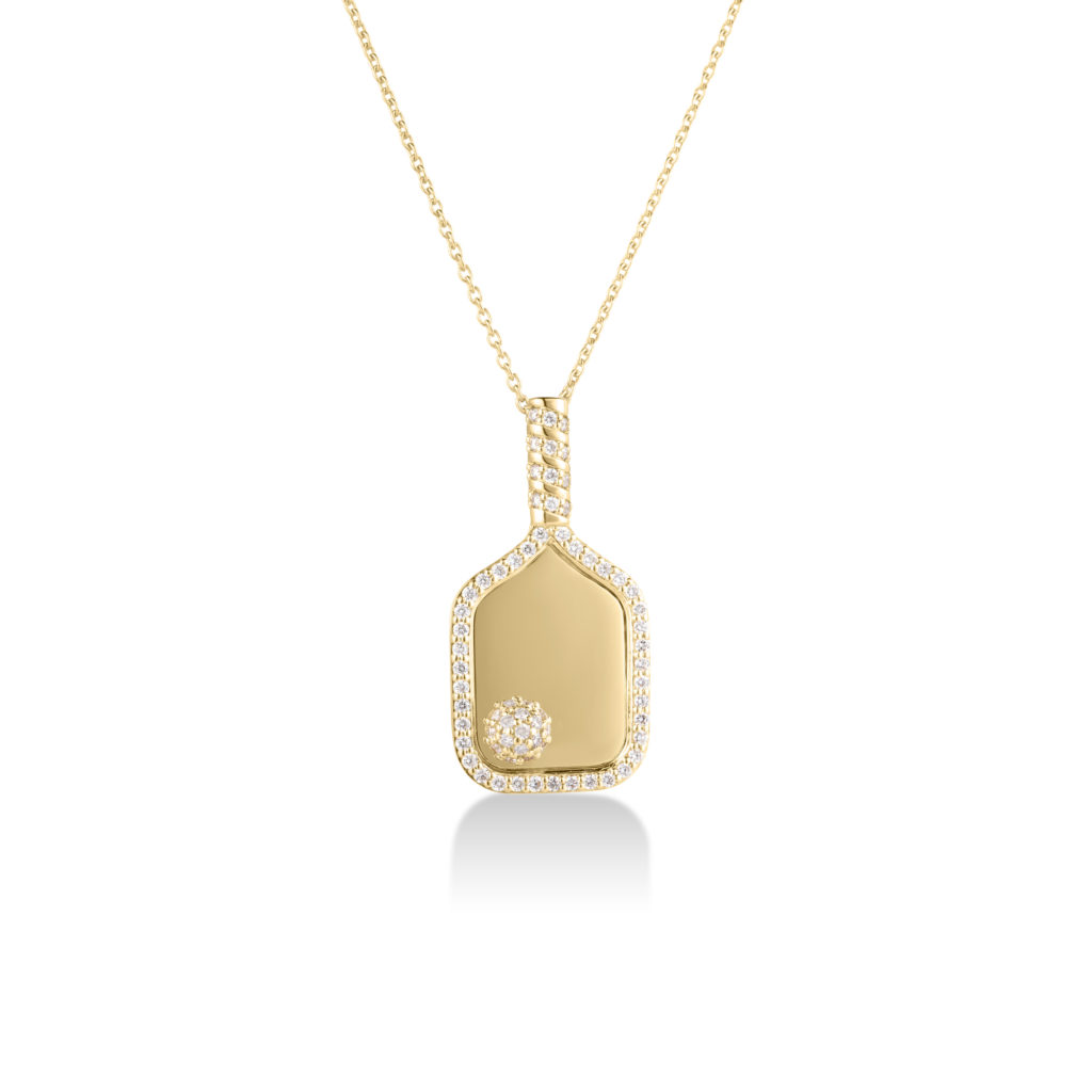 Gold pendant necklace with a diamond-studded edge and smooth gold drop pendant on a thin gold chain (jewelry product image).