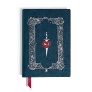 Teal journal cover with an intricate white frame, featuring a dagger piercing a red heart in the center and a red ribbon bookmark.