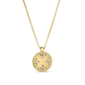 Gold necklace with a round, ornate pendant encrusted with clear stones.