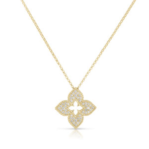 Gold chain necklace with a pavé-set diamond quatrefoil pendant on a white background