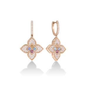 Rose-gold drop earrings with a four-pleurate flower pendant encrusted with diamond accents, hanging from a diamond-studded hoop.