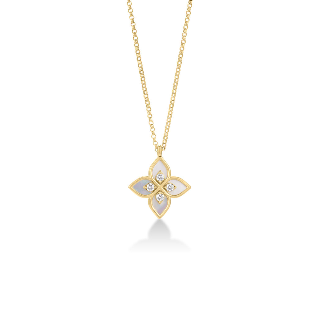 Gold chain necklace with a four-petal flower pendant featuring white inlays and small diamonds in each petal's center.