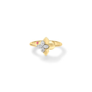 Gold ring featuring a four-petal flower motif with diamond petals and a central diamond, accented by a small pink gemstone to the side on a white background