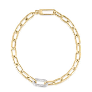 Close-up of a gold chain necklace with a diamond-studded link against a white background