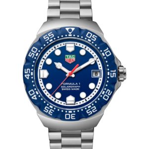 Silver TAG Heuer Formula 1 stainless steel watch with blue dial, rotating blue bezel, and date window at 3 o'clock
